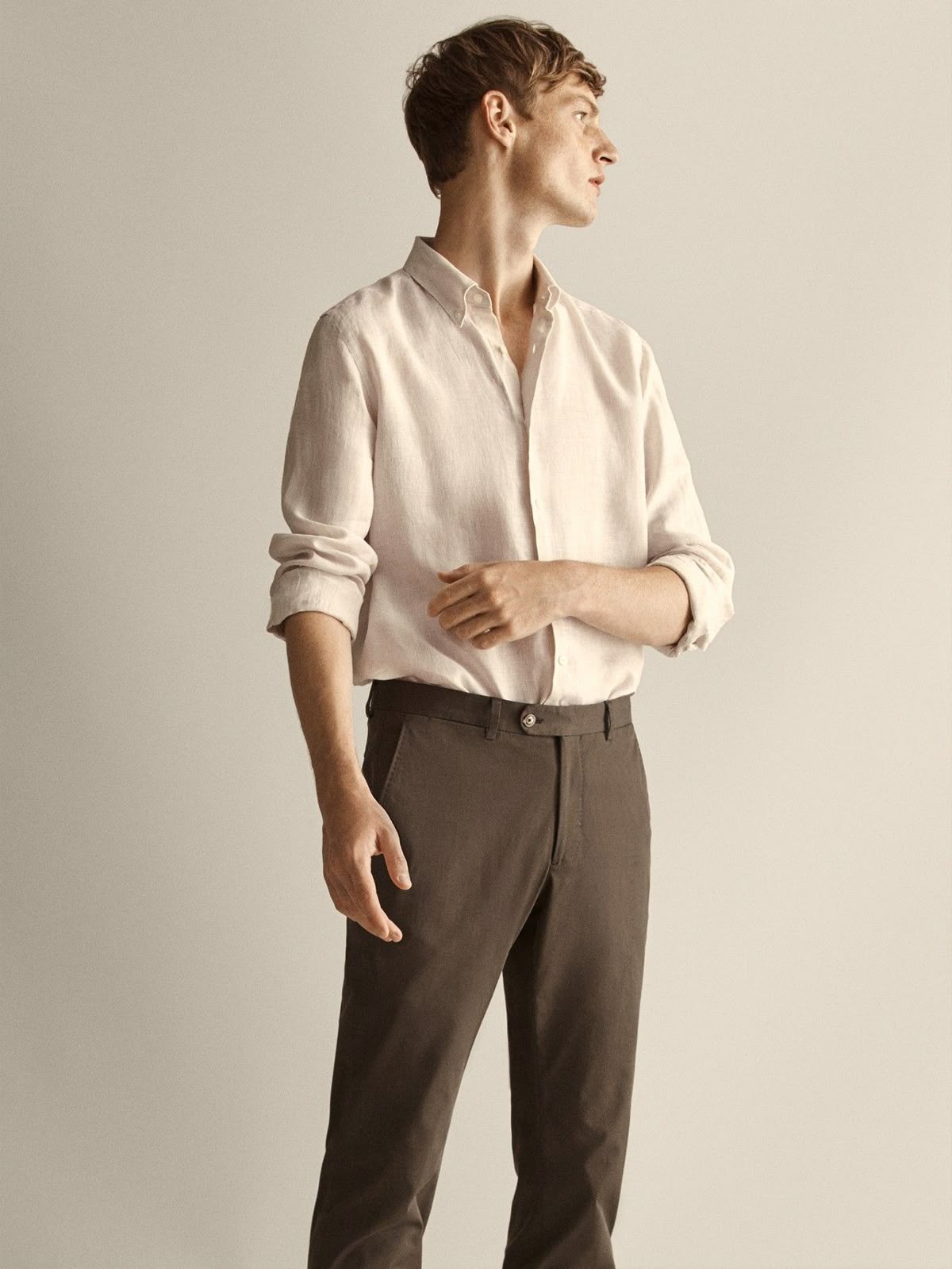 Relaxed sand linen shirt in a softly lit studio